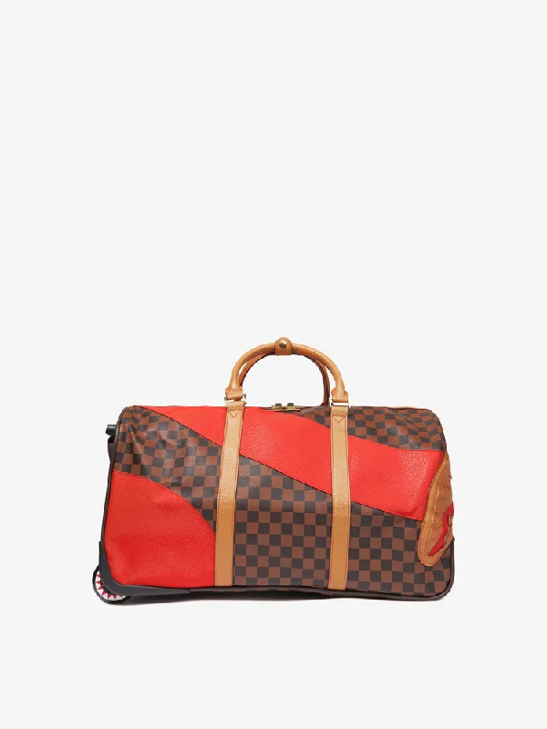 Waterproof luggage covers for protection against rain on outdoor tripsSprayground Duffel Wheely