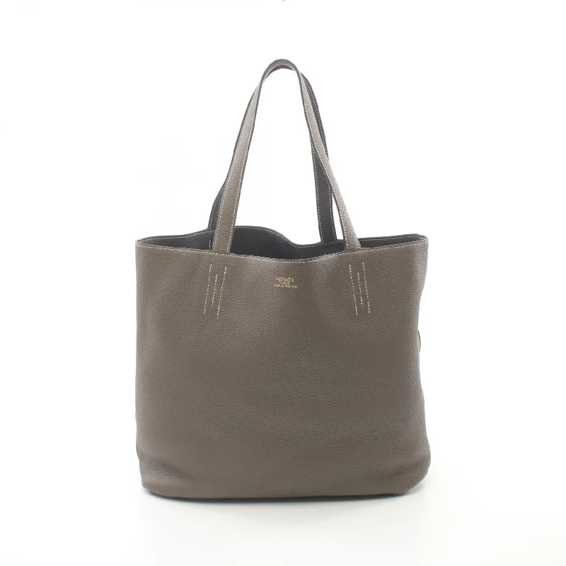 Quilted Tote Bag in Cream with Silver Hardware for a Classic and Sophisticated StyleHermes Double Sens 45 Tote Bag Brown/Blue Quilted Tote Bag in Cream with Silver Hardware for a Classic and Sophisticated StyleHermes Double Sens 45 Tote Bag Brown/Blue