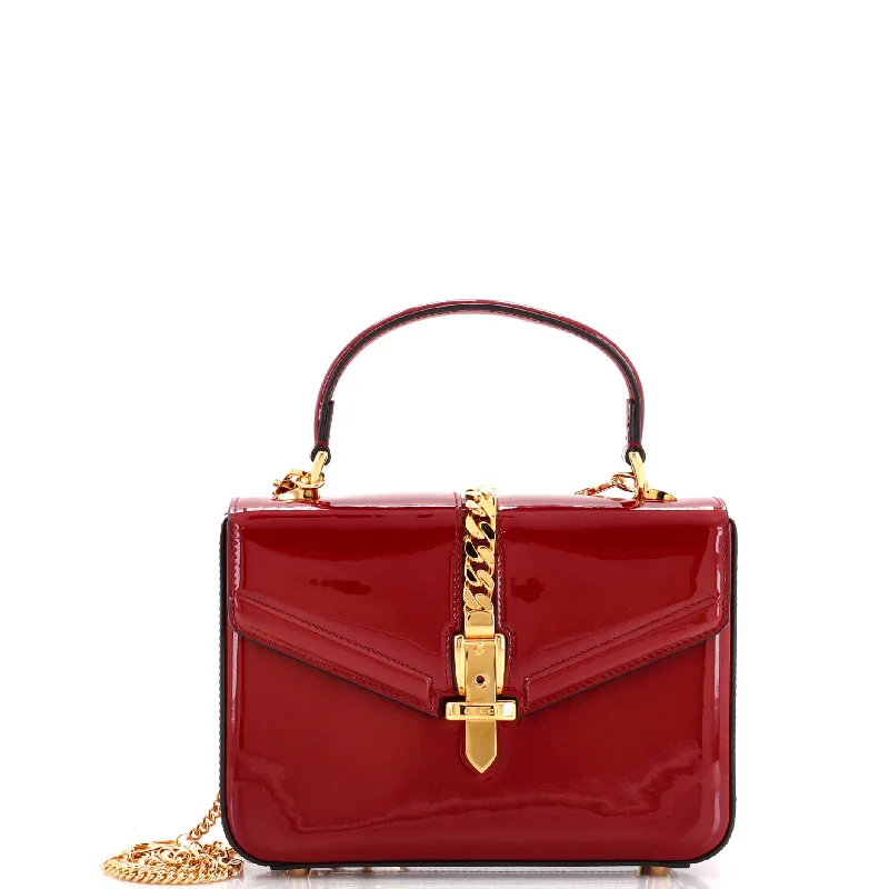 Suede Shoulder Bag in Pink with Tassel Accents for Casual OutingsSylvie 1969 Top Handle Bag Patent Mini Suede Shoulder Bag in Pink with Tassel Accents for Casual OutingsSylvie 1969 Top Handle Bag Patent Mini