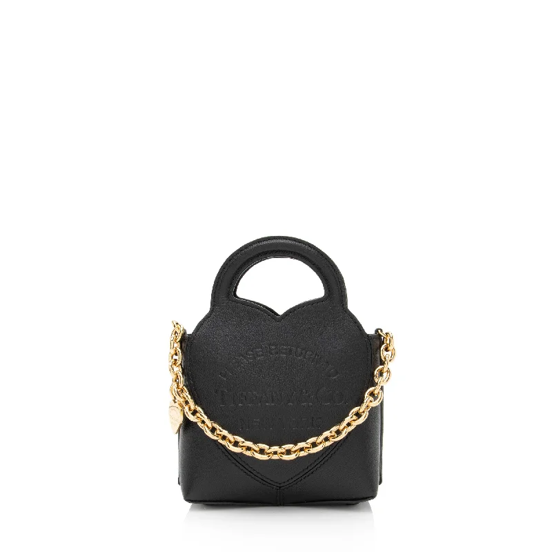 Faux Fur - Trimmed Tote Bag in White for a Cozy Winter LookTiffany & Co. Leather Charm Small Tote Faux Fur - Trimmed Tote Bag in White for a Cozy Winter LookTiffany & Co. Leather Charm Small Tote
